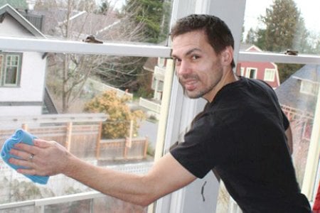 Man cleaning a window.